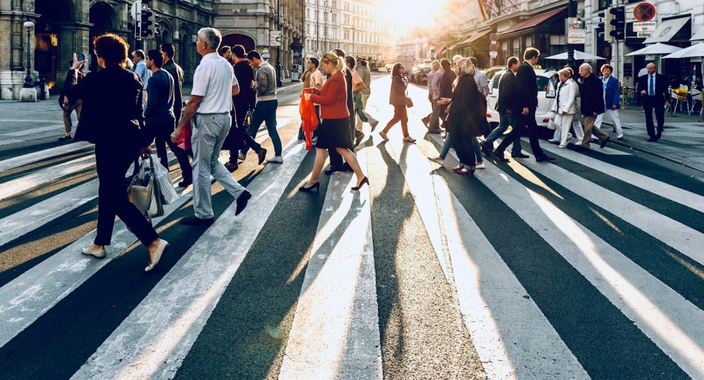 group of people walking on pedestrian lane