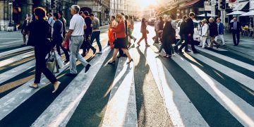 group of people walking on pedestrian lane